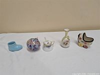 group shot of five miniature decorative items