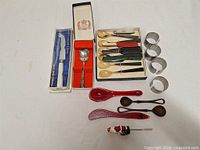 Full lot overview showing all cutlery and napkin rings