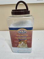 Front view of Pet's Pal Silica Cat Litter Crystals container showing fill level