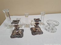 All eight candle holders arranged on table