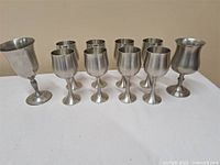 all ten stainless goblets on table