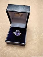 Ring in jewellery box showing stone and setting