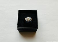 Front view of sterling ring in box showing large oval stone