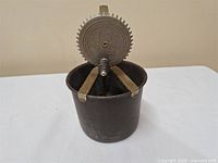 Beater assembled in metal cup