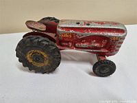 Left side view showing Massey Harris 44 branding and wheel details