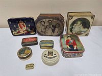 Group shot of all eight tins