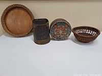 Group shot showing all four items: wood tray, Silver Gloss Starch tin, decorative round tin, wicker basket