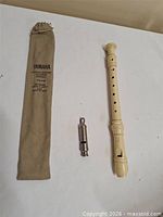 Recorder, whistle and bag laid out