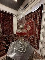 Full view of lamp on marble pedestal