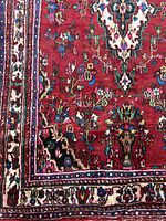 Close-up of corner front side showing border and floral motifs