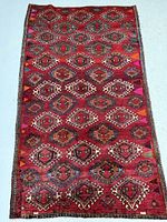 Full view of Persian Goochan rug showing overall design and size