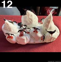 Full view of glass iceberg base with penguins