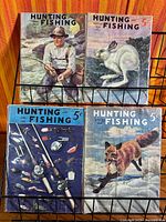 Four bagged Hunting and Fishing magazines on rack