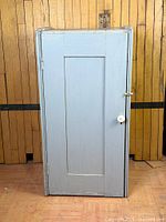 Front view of light blue single-door locker
