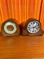 Both wooden mantle clocks side by side