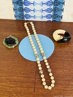 Overview of necklace, bangle, and pendant