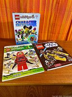 All three books laid out on table