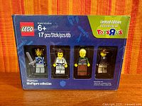 Front of sealed LEGO Warrior Minifigure Collection box showing all four minifigures and Toys R Us exclusive label