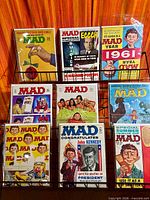 Rack displaying nine bagged Mad magazines