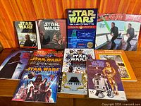 All fourteen Star Wars books laid out front and back rows