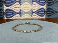Bracelet laid flat showing full line of CZ stones