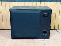 Front view showing grille and port