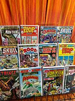 Full view of 12 bagged comics on wire rack