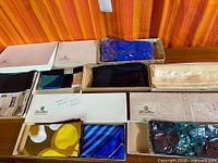 Overview of boxed scarves and gloves on table