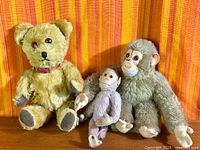 Group shot of teddy bear and two monkeys