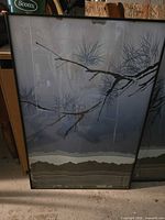Front view showing botanical print, glass, black frame