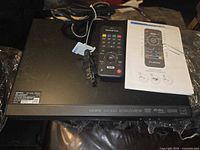Top view showing player, remote, power cord and manual