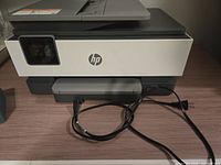 Front view of printer with power cord