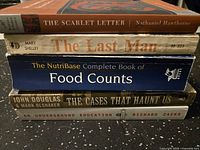 Spines of five books showing titles and authors