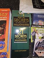 Front covers of EMT workbook, two 21 Secrets booklets, Success booklet, Yancey booklet and shipping sleeve