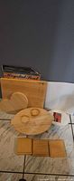 All items grouped: square board, heart blank, riser, coasters, oval canvas visible