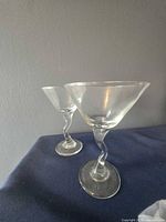 Pair of clear glass martini glasses showing overall form