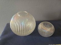 Both vases side by side showing size difference and iridescent finish