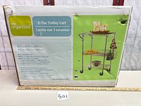 Box front displaying Real Organized 3-Tier Trolley Cart specifications and image