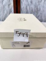 Coach shoe box with product label visible