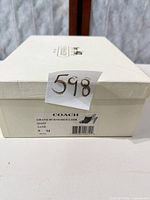 Coach shoe box with label Grand Burnished Lthr Q1339 Sand 9M