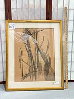 Full view of framed artwork with ruler for scale