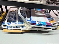 Stacked view of folded chairs showing both styles and frames