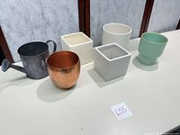 All six items lined up showing sizes and materials