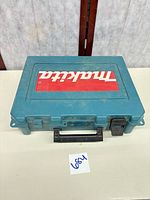 Closed Makita teal plastic carry case top view