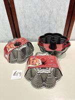 Three Festival Bundt pans with packaging sleeves