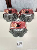 Three Nordic Ware Festival Bundt pans with labels