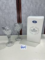 Two cut crystal goblets beside RCR Oneida box