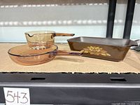 Group shot showing Visions saucepan, Visions skillet, and Fire King loaf pan