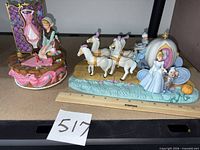 Both music boxes on shelf with lot marker