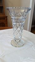 Full view of clear cut crystal vase showing flared rim, patterned body and pedestal base
